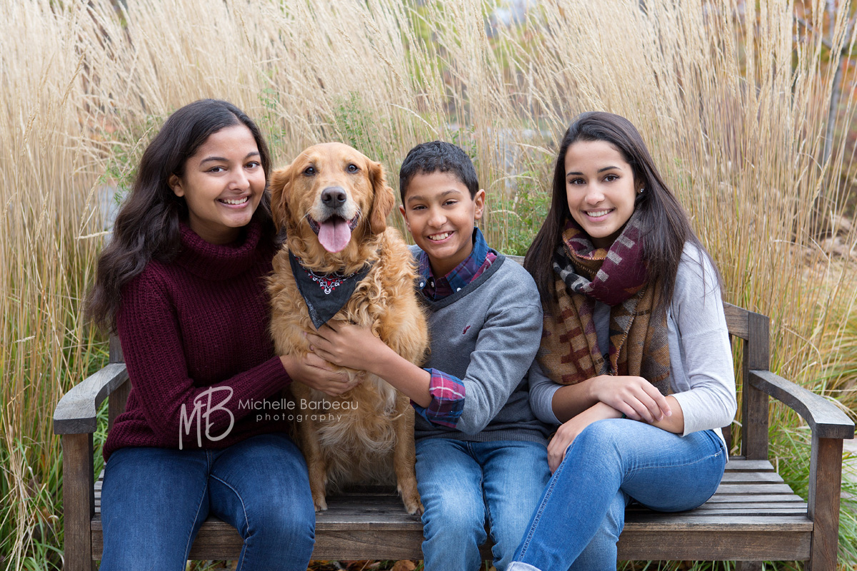 siblings with pet dog