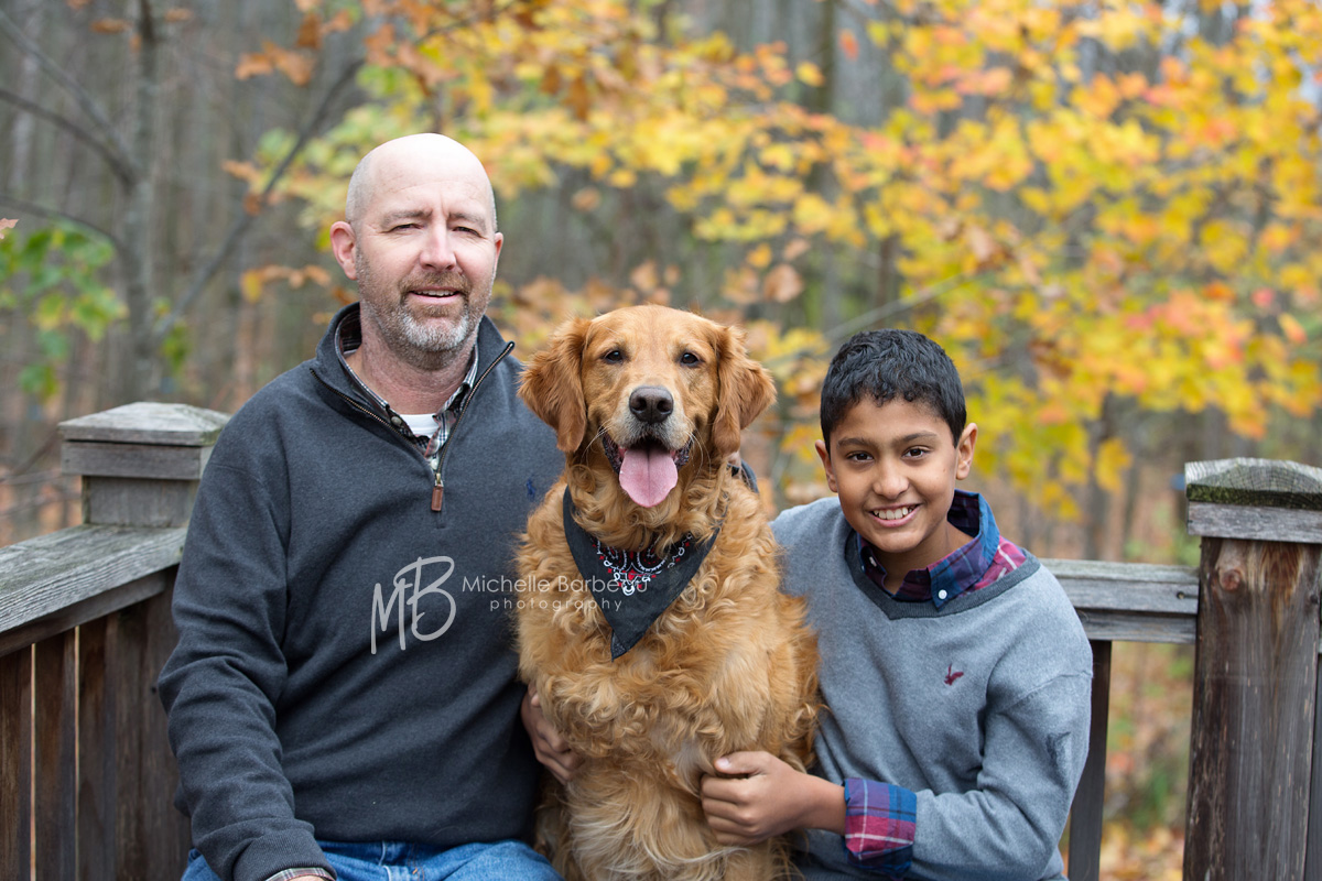 father and son with dog