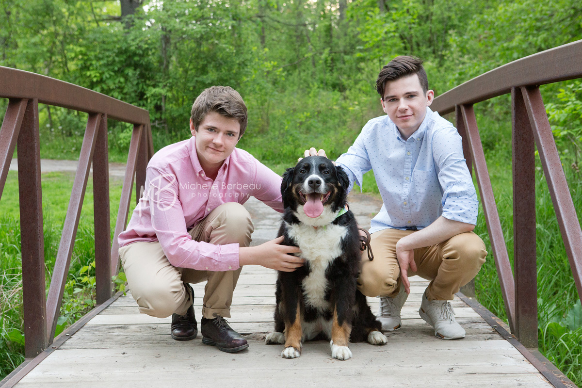teen brothers with pet dog