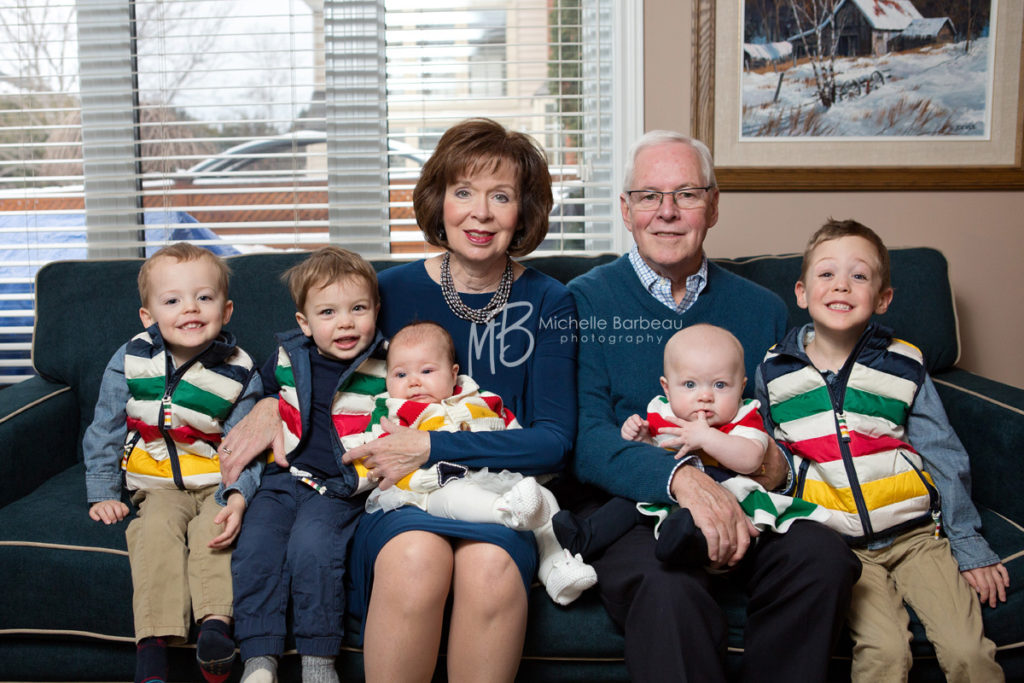 proud grandparents with their 5 grandchildren