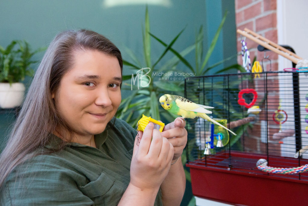 in home session: family photo with pet budgie